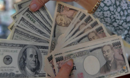 Dollar sinks on yen intervention talk, gold breaks $5,000