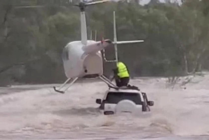 Men and dog rescued from australian floodwaters by helicopter