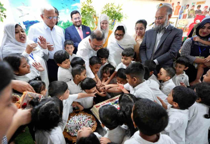 PM plays with children, cuts cake at Bhumi Bhaban day-care centre