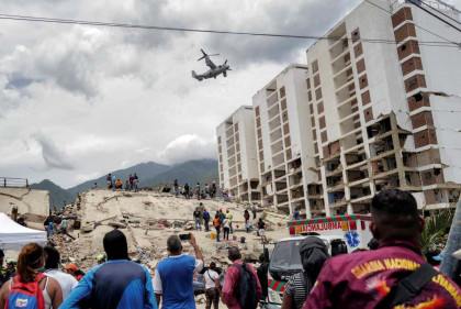 Key port reopens in Venezuela for US aid as funeral process begins